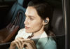 Woman listening to Beoplay E8