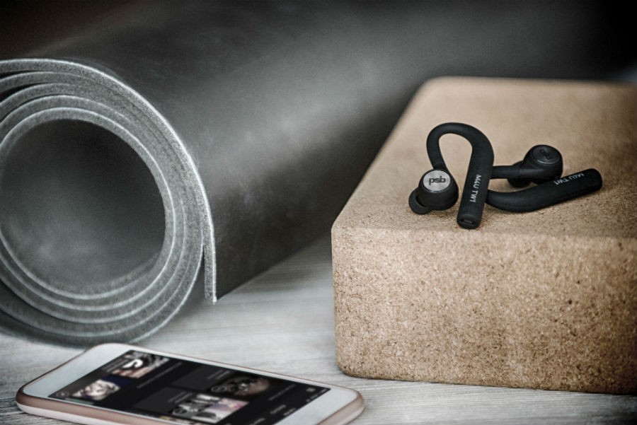 M4U TW1 earphones next to yoga mat