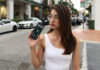 Vanessa holding the Sony Xperia XZ2 on the streets
