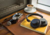 Plantronics BackBeat GO 605 on notebook with camera and coffee in background