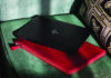 HP Envy x360 13 on red laptop case on couch