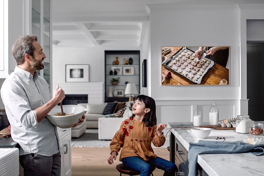Family enjoying The Frame in the kitchen