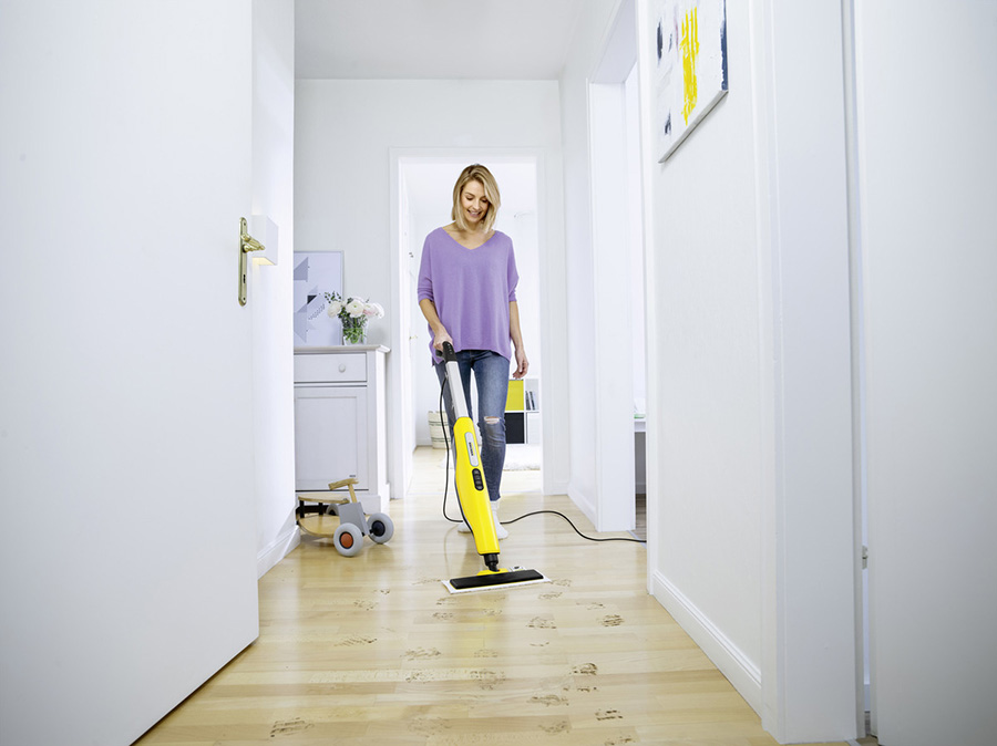 Woman using the Karcher SC 3 Upright EasyFix Steam Mop