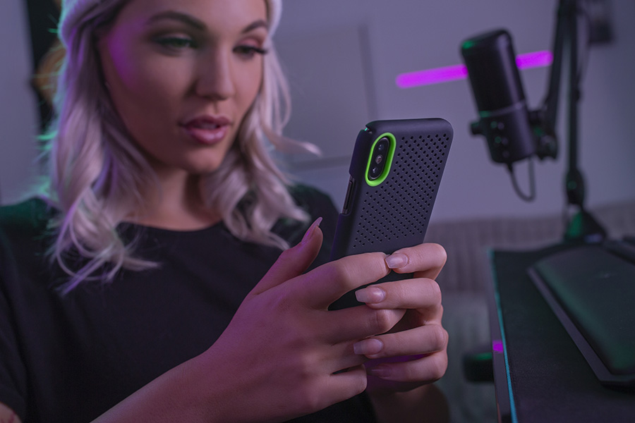 Woman using a phone with the Razer Arctech cover