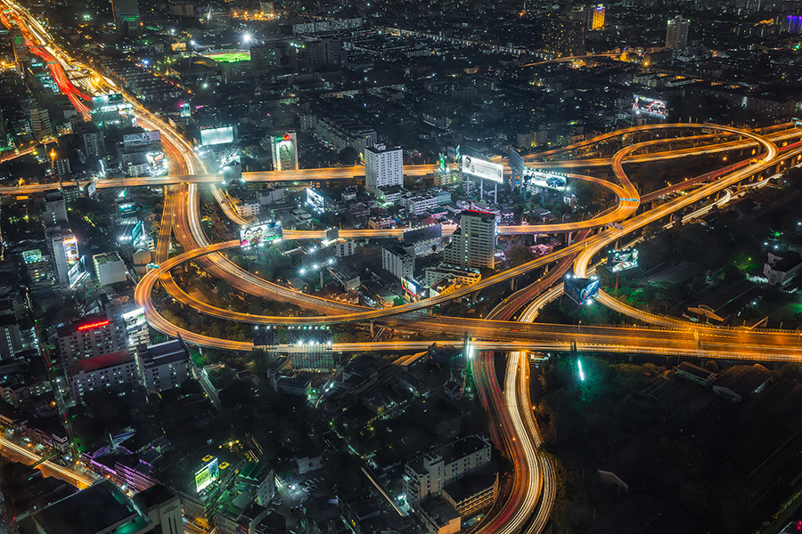 Aerial view of Bangkok Highways at night with traffic lights