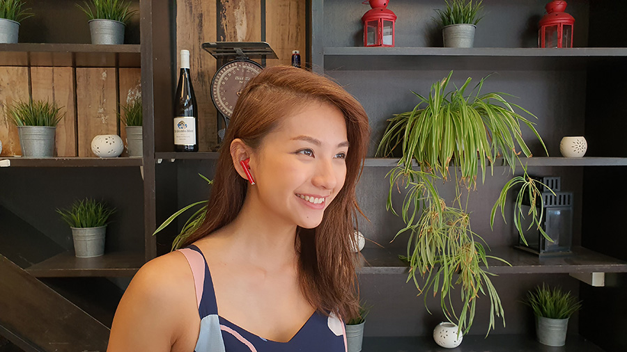 Vanessa working with the Huawei Freebuds 3