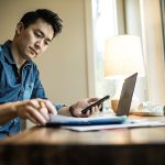Man (early 30s) working in home office